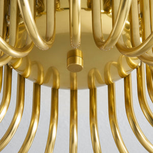 Barney Semi Flush 49.25" in aged brass shown from the front to reveal the shade profile and mounting canopy.