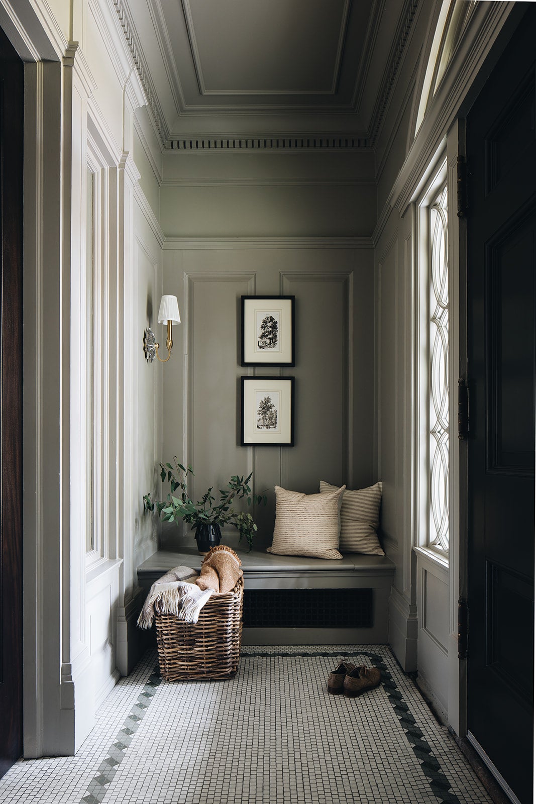 Barton Wall Sconce 7.5" in aged brass styled in a curated living room for warm, layered light at Laurie Yapp Home.