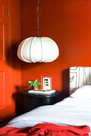 Bayu Pendant 26" styled in a welcoming entryway for warm, layered light at Laurie Yapp Home.