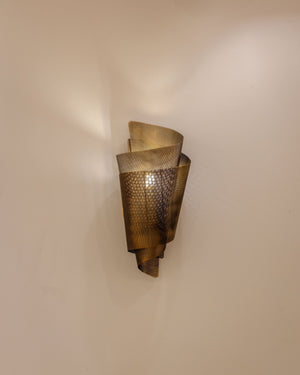 Blaisdell Wall Sconce styled in a curated living room for warm, layered light at Laurie Yapp Home.
