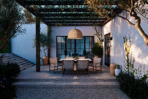 Huxley Exterior Pendant 34" styled in an elegant dining room for warm, layered light at Laurie Yapp Home.