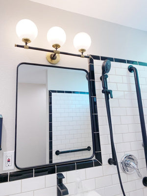 Bowery Bath And Vanity 23.75" styled in a primary ensuite for warm, layered light at Laurie Yapp Home.