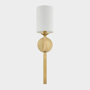 Close-up of the Brewster Wall Sconce in aged brass showing the arm curve and shade silhouette.
