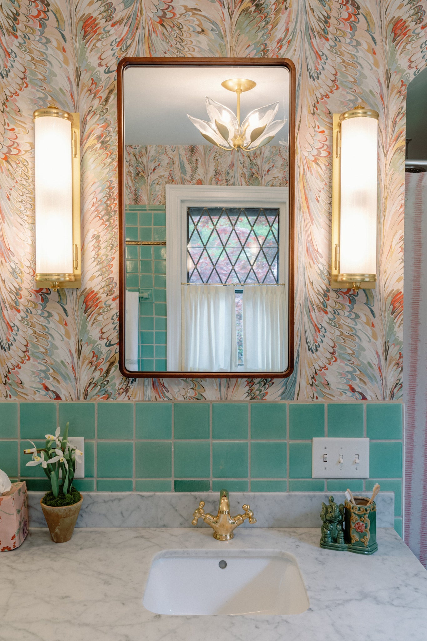 Blossom Semi Flush in aged brass styled in a hallway for warm, layered light at Laurie Yapp Home.