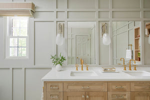 Bruckner Wall Sconce in polished nickel styled in a curated living room for warm, layered light at Laurie Yapp Home.