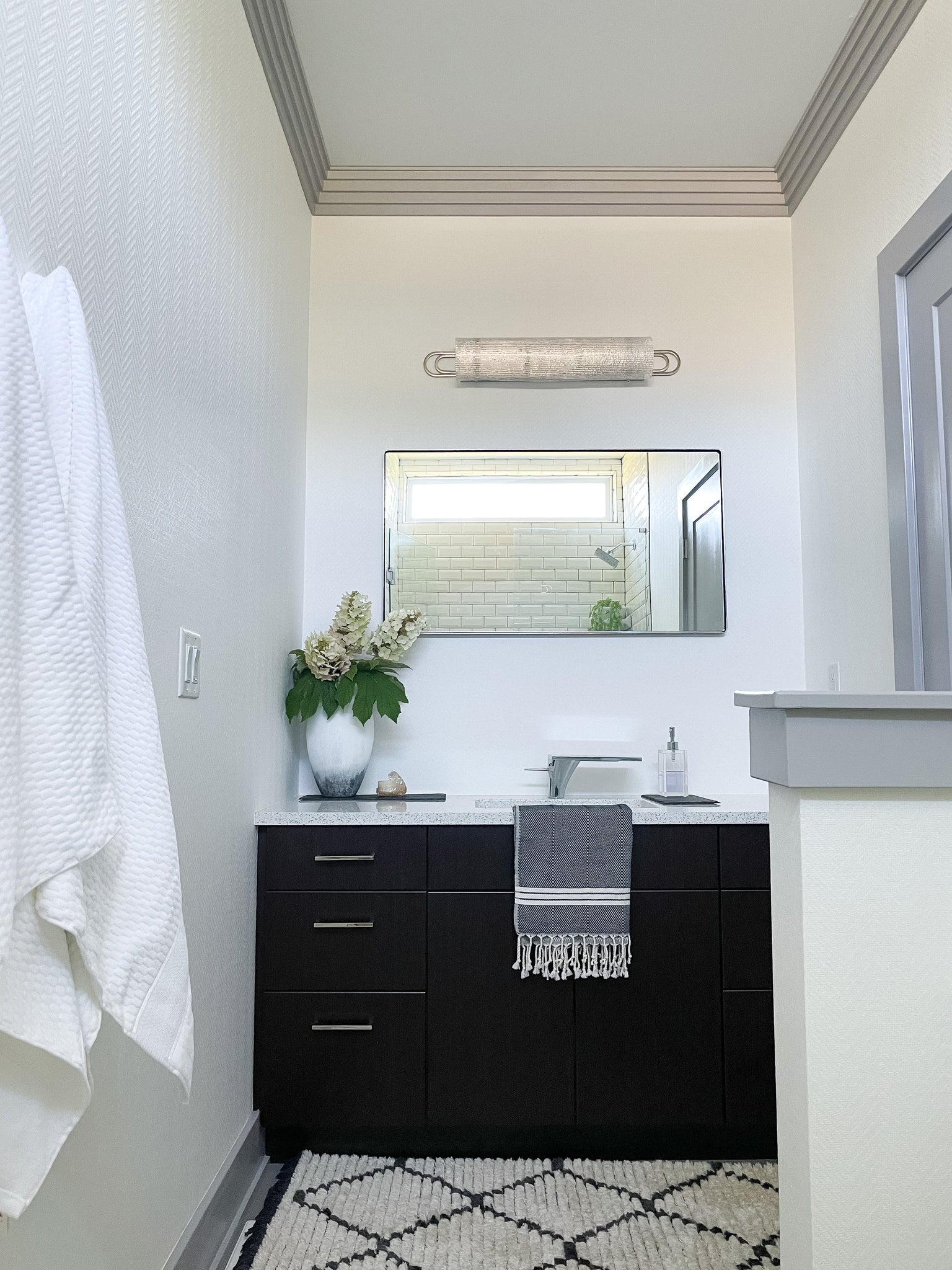 Buckley Bath And Vanity 31" in polished nickel styled in a powder room for warm, layered light at Laurie Yapp Home.
