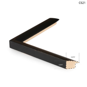 Black wooden frame corner with a light wood interior, showcasing a sleek design.