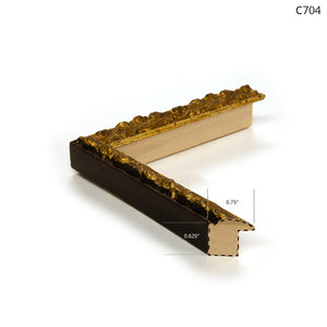 Gold ornate picture frame corner with dark wood and detailed design