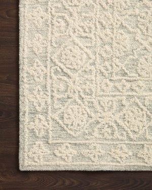 Side view of the Cecelia Mist / Ivory rug.