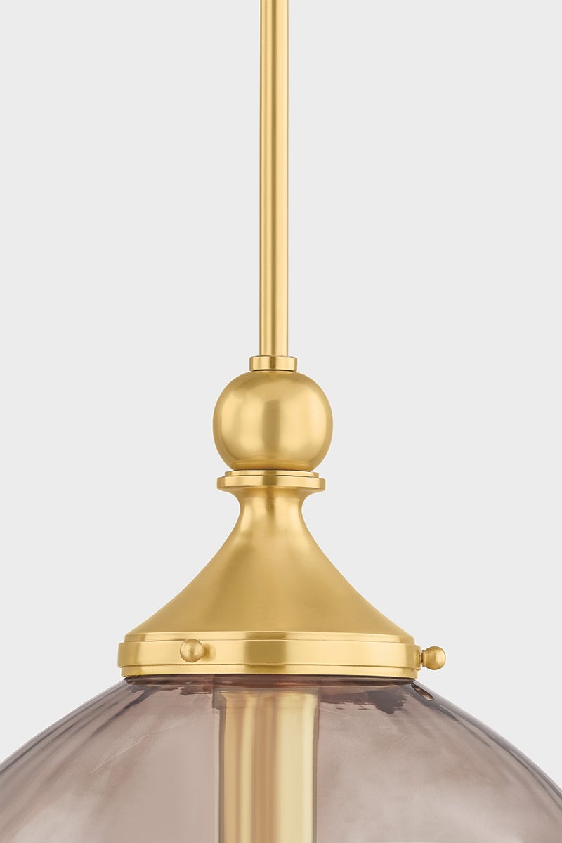 Close-up of the Chatton Pendant 12" in aged brass showing the shade shape and metal detail.