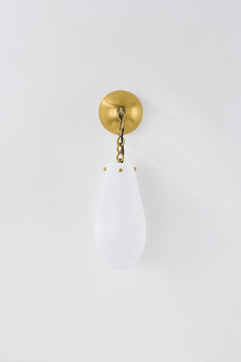 Clarkstown Wall Sconce in aged brass shown from a second angle to highlight the arm curve and shade silhouette.