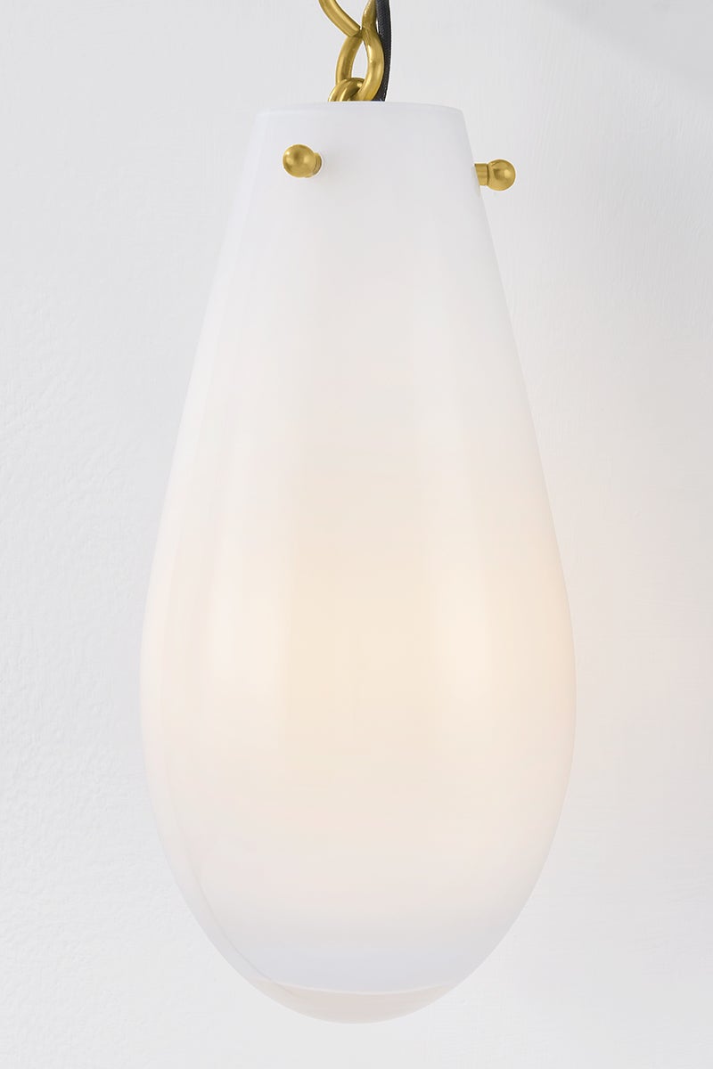 Close-up of the Clarkstown Wall Sconce in aged brass showing the arm curve and shade silhouette.