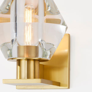 Cooperstown Wall Sconce in aged brass shown from the front to reveal the arm curve and shade silhouette.