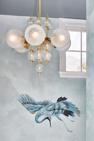 Calypso Chandelier 27.25" in aged brass shown from the front to reveal the frame, arms, and shade detail.