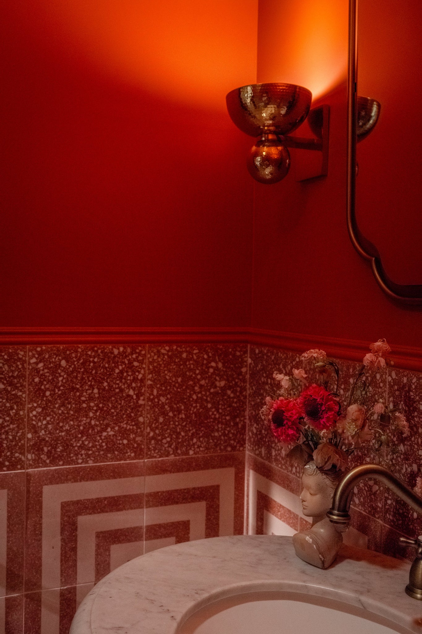 Catania Wall Sconce styled in a warmly lit hallway for warm, layered light at Laurie Yapp Home.