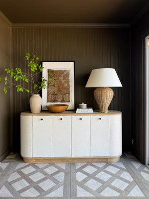 Chatsworth Table Lamp in aged brass styled in a curated console for warm, layered light at Laurie Yapp Home.