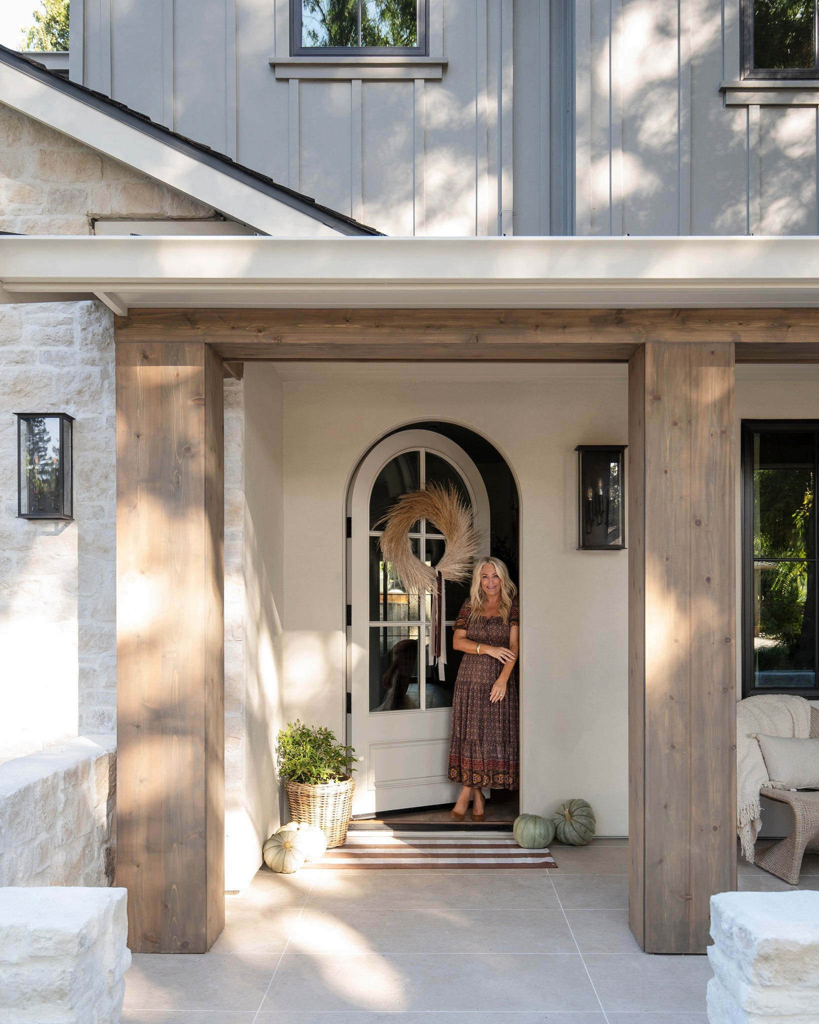 Chauncey Exterior Wall Sconce 9.5" x 19" styled in a modern bathroom for warm, layered light at Laurie Yapp Home.