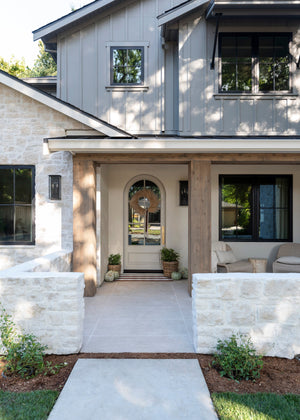 Chauncey Exterior Wall Sconce 9.5" x 19" styled in a curated living room for warm, layered light at Laurie Yapp Home.