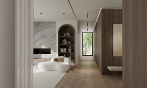 Truett Wall Sconce in aged brass styled in a curated living room for warm, layered light at Laurie Yapp Home.