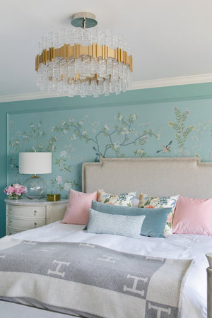 Ciro Chandelier styled in a formal living room for warm, layered light at Laurie Yapp Home.