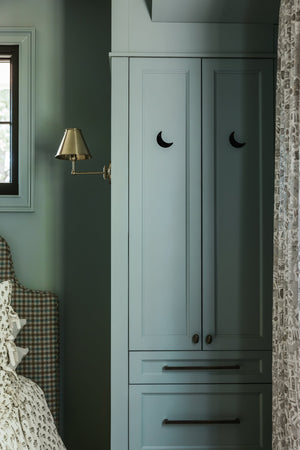 Classic No.1 Wall Sconce 7.5" x 10.5" in Aged Brass styled in a warmly lit hallway for warm, layered light at Laurie Yapp Home.
