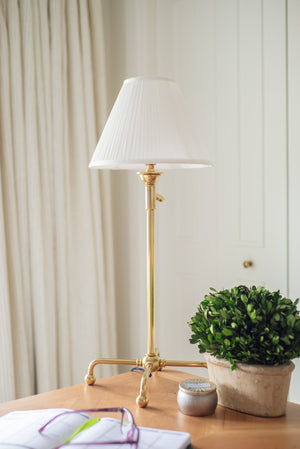 Classic No.1 Table Lamp in aged brass styled in a bedroom nightstand for warm, layered light at Laurie Yapp Home.
