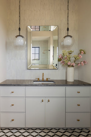 Clementon Pendant 17" in dark bronze styled in an elegant dining room for warm, layered light at Laurie Yapp Home.
