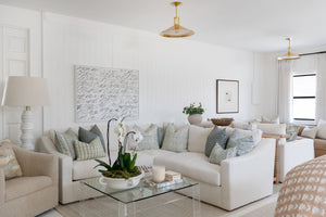 Clermont Pendant 20" in aged brass styled in an elegant dining room for warm, layered light at Laurie Yapp Home.