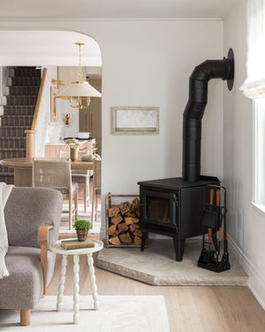 Hampshire Picture Light 23.25" in aged brass styled in a reading room for warm, layered light at Laurie Yapp Home.