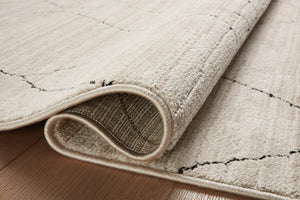 Close-up detail of the Darby Sand / Charcoal showing its pile and weave.