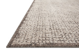 Side view of the Darby Ivory / Stone rug.