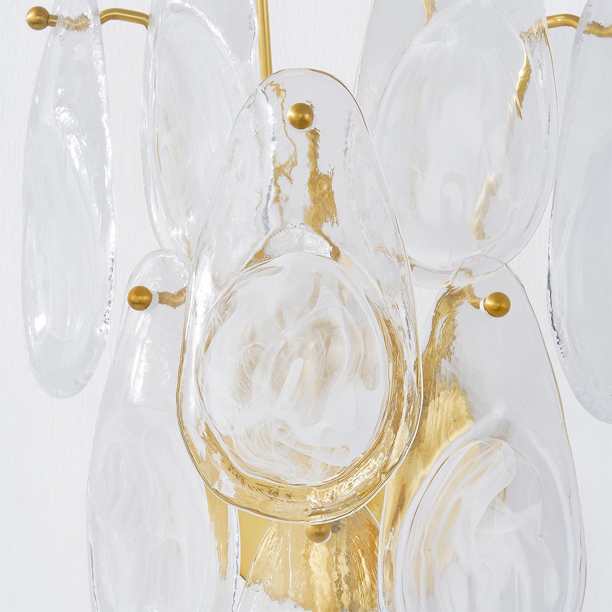 Darcia Wall Sconce in aged brass shown from a second angle to highlight the arm curve and shade silhouette.