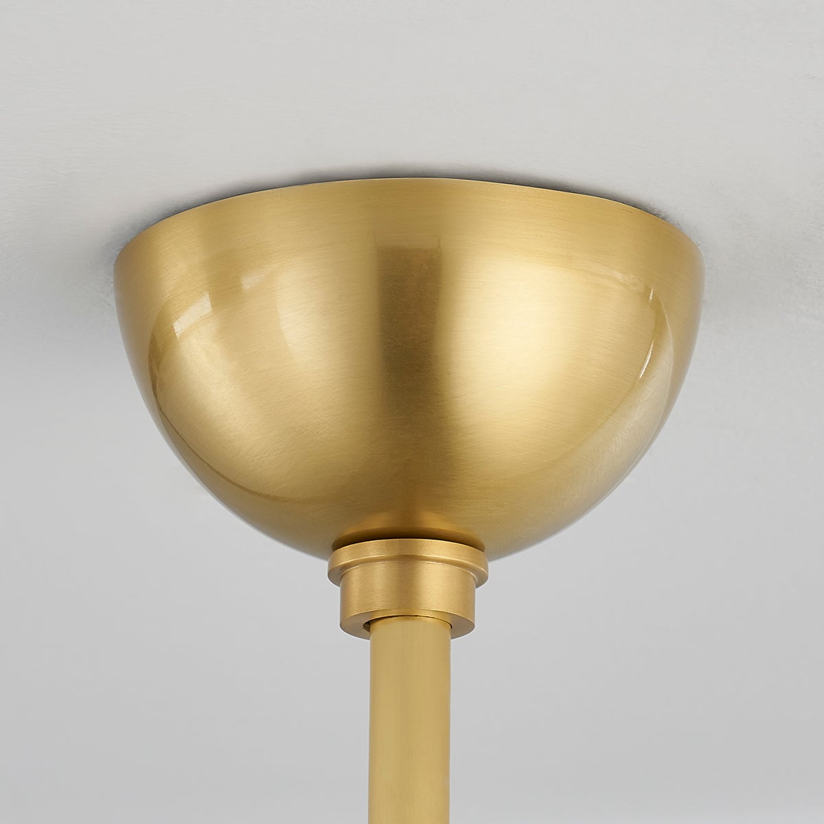 Dorval Pendant 13" in aged brass shown from the front to reveal the shade shape and metal detail.