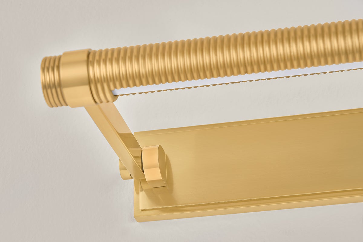Close-up of the Duell Picture Light 18" in aged brass showing the arm curve and shade proportion.