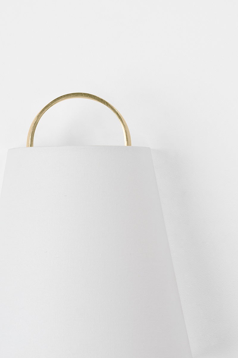 Close-up of the Dota Wall Sconce showing the arm curve and shade silhouette.