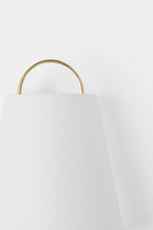 Close-up of the Dota Wall Sconce showing the arm curve and shade silhouette.