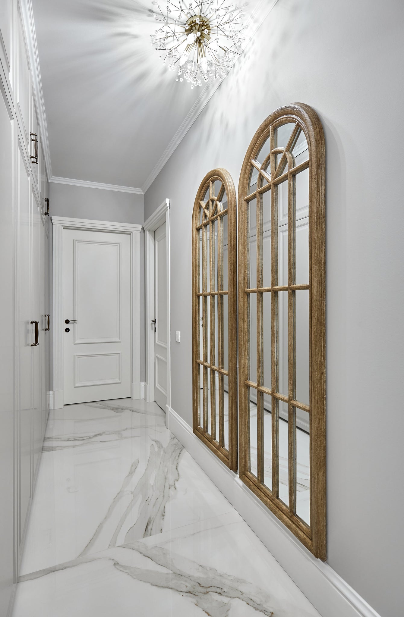 Dunkirk Semi Flush 20" in aged brass styled in a hallway for warm, layered light at Laurie Yapp Home.