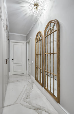 Dunkirk Semi Flush 20" in aged brass styled in a hallway for warm, layered light at Laurie Yapp Home.