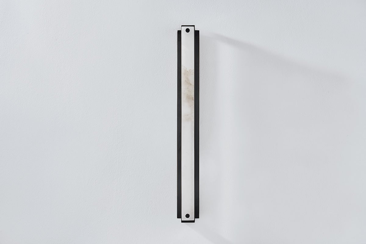 Close-up of the Edgemere Wall Sconce in dark bronze showing the arm curve and shade silhouette.