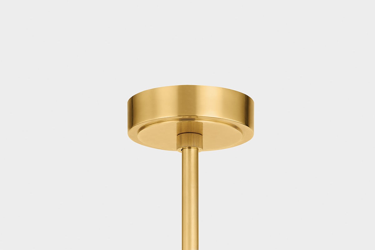 Close-up of the Edgemere Pendant 11" in aged brass showing the shade shape and metal detail.