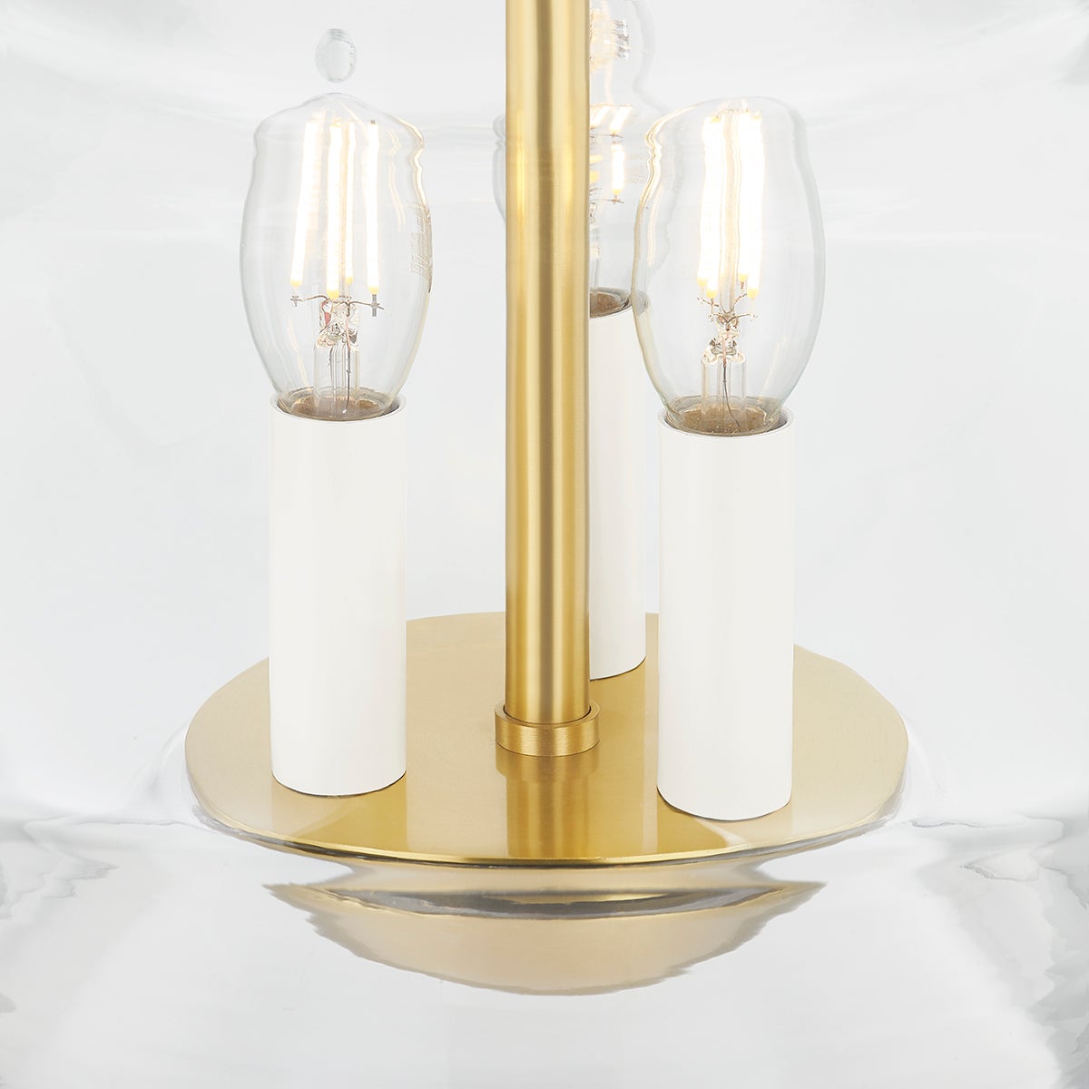Close-up of the Edmonton Lantern 15" in aged brass showing the frame and glass panel detail.