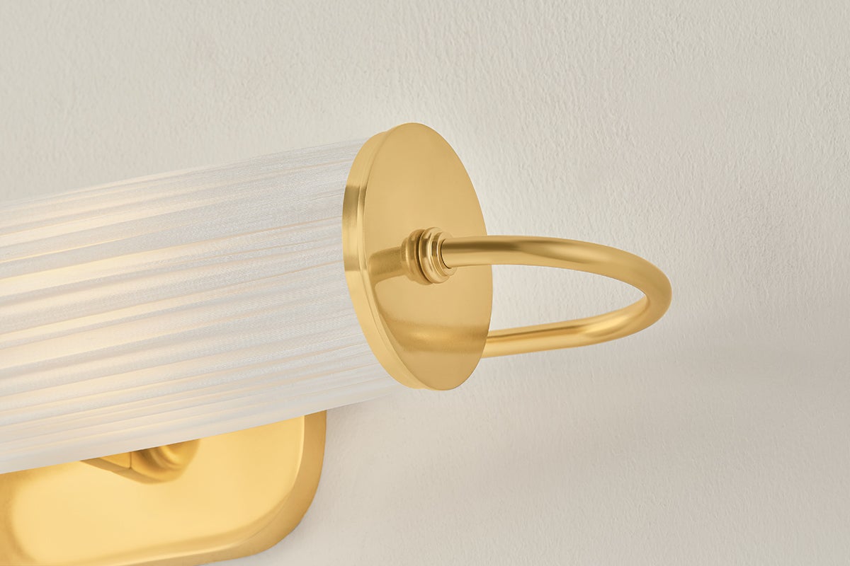 Elaine Picture Light in aged brass shown from the front to reveal the arm curve and shade proportion.