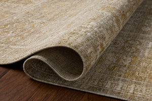 Elora Mushroom / Ochre styled underfoot in a layered living room at Laurie Yapp Home.