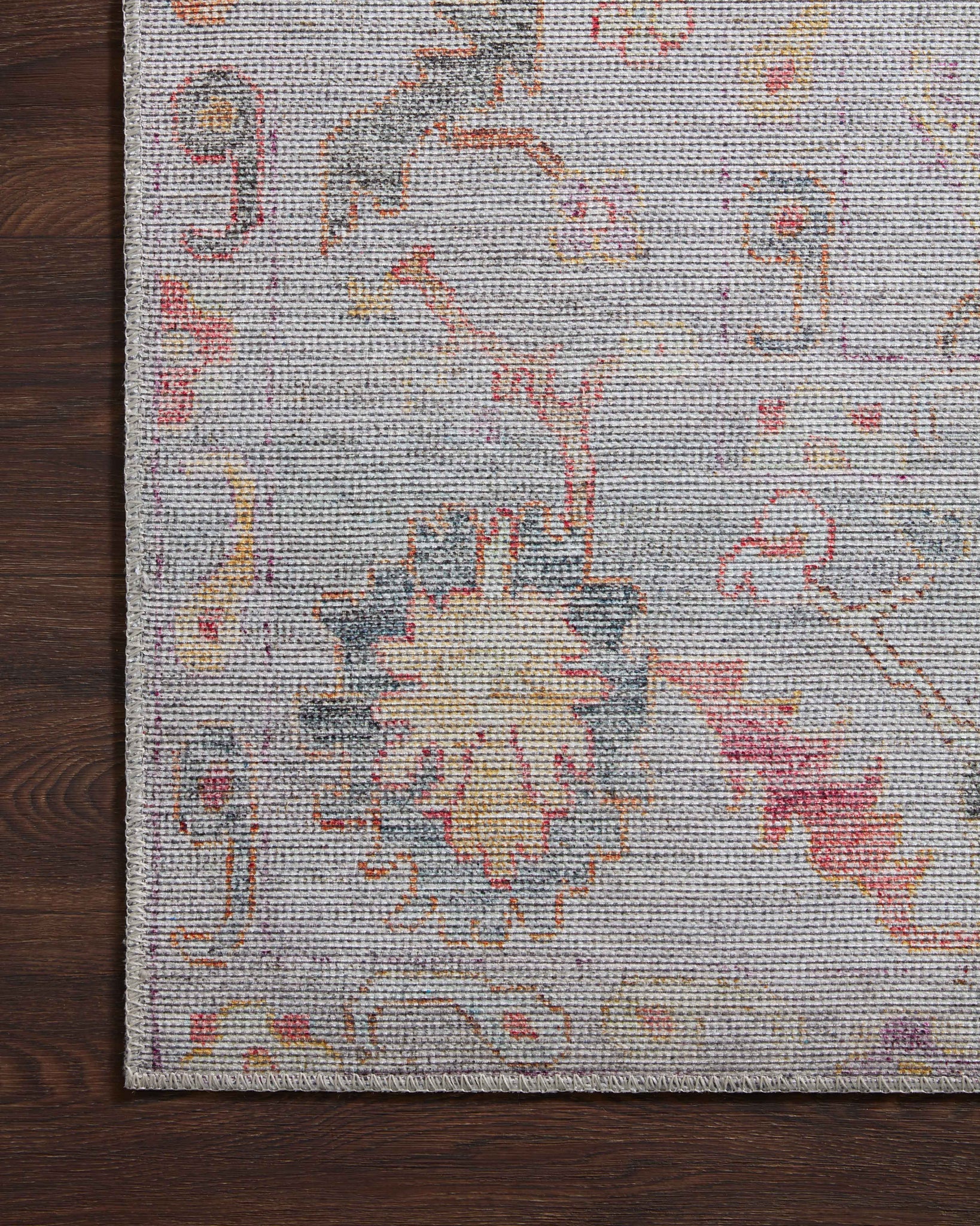 Elysium Silver / Multi shown in a curated living room setting at Laurie Yapp Home.