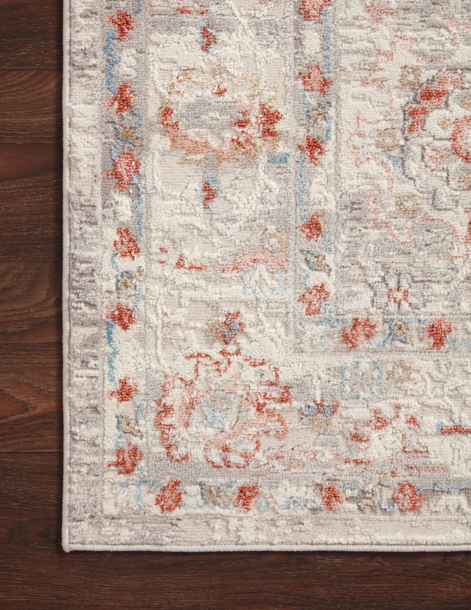 Estelle Ivory / Rust shown in a curated living room setting at Laurie Yapp Home.