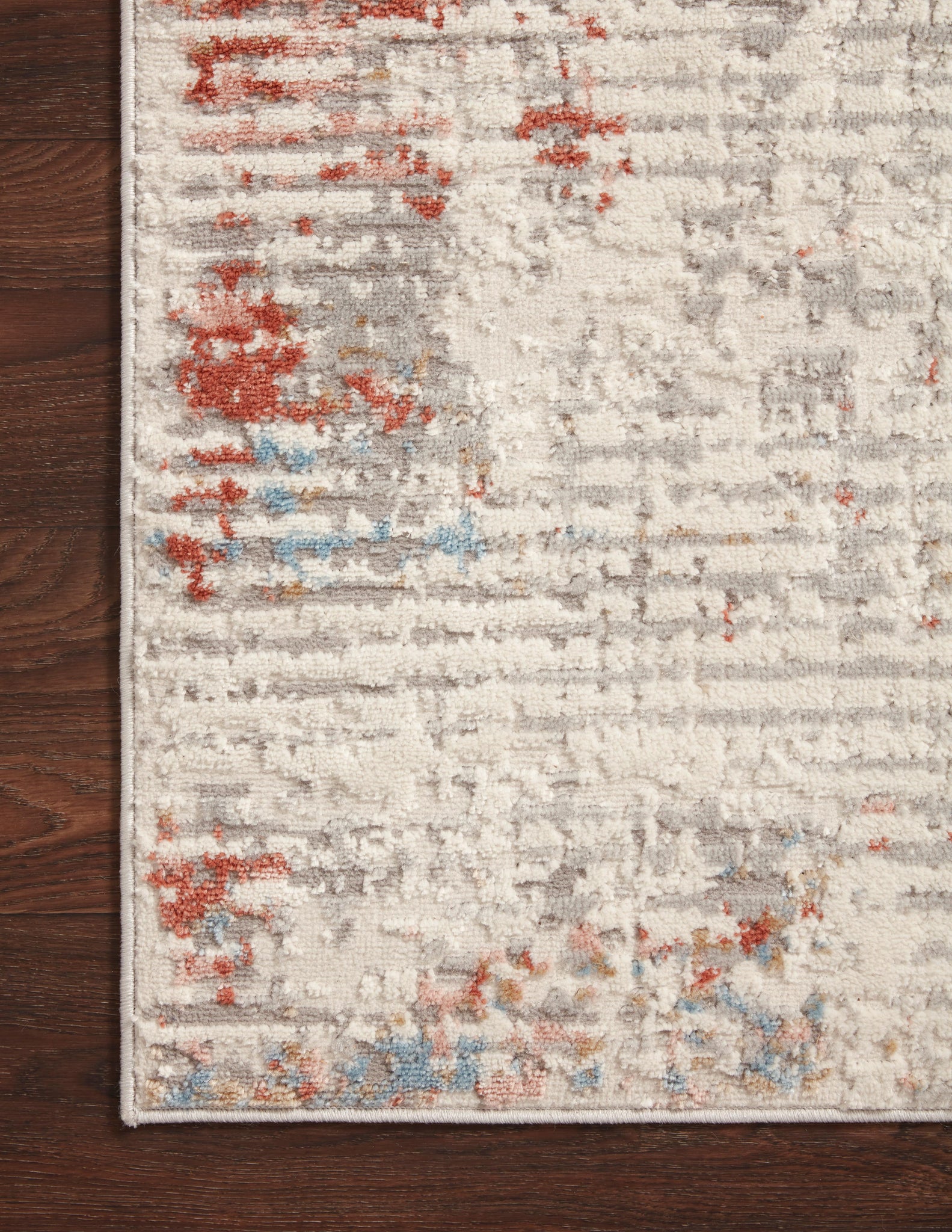 Close-up detail of the Estelle Ivory / Multi showing its pile and weave.