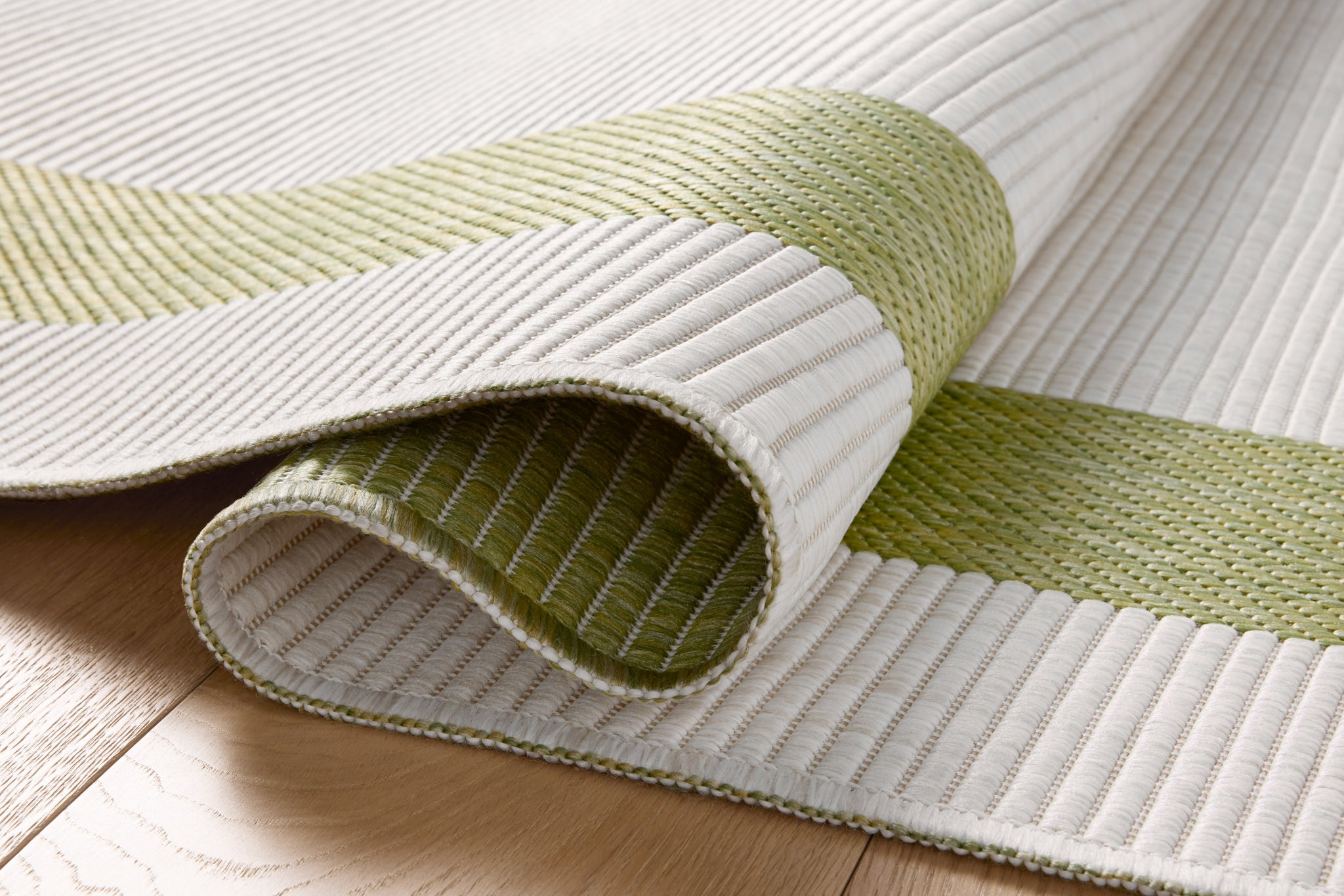 Easton Green / Ivory shown from a different angle to reveal its pattern.