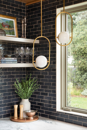 Everley Pendant 13.75" styled in a welcoming entryway for warm, layered light at Laurie Yapp Home.
