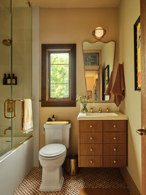 Everley Wall Sconce styled in a curated living room for warm, layered light at Laurie Yapp Home.