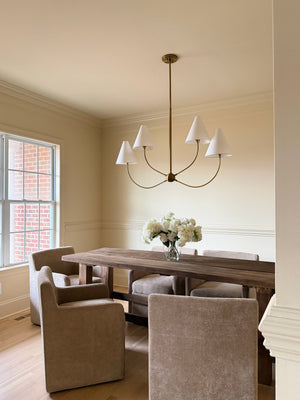 Evermore Linear styled in an entry hallway for warm, layered light at Laurie Yapp Home.